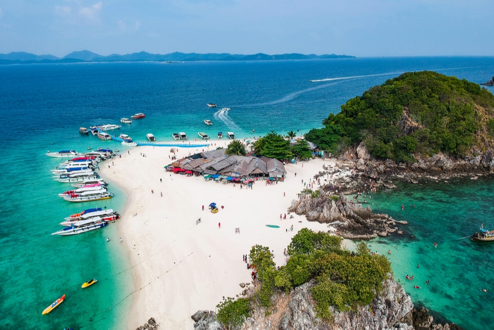 Aerial view of Koh Khai Nak featuring people and several boats - Thai Pass