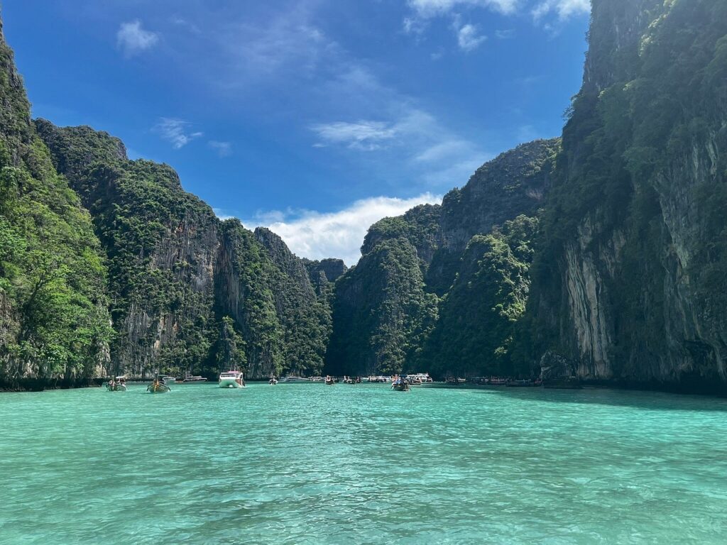 Clear water with limestone cliffs in the Phi Phi Islands - Thai Pass