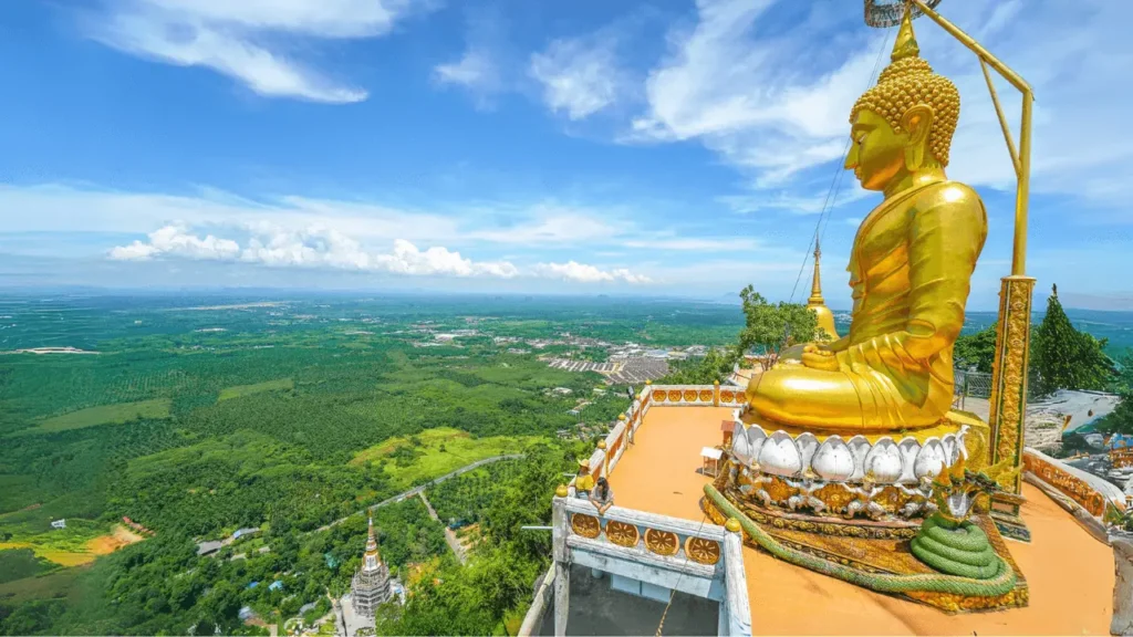 The statue of Buddha on the Tiger Cave Temple in Krabi with panaromic views - Thai Pass