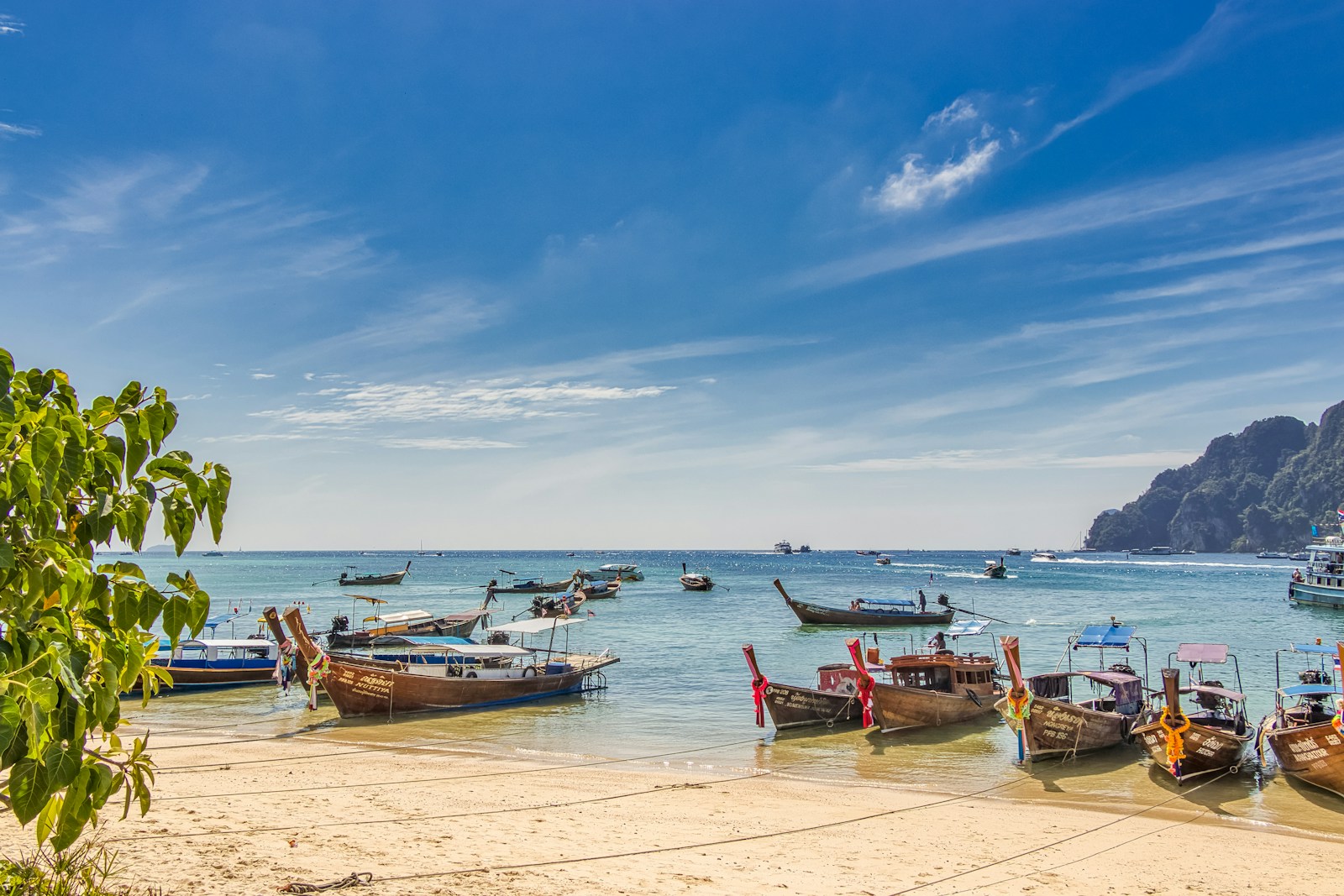 Long tail boats on the boat Ao Nang beach shore - Thai Pass